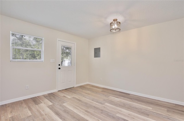 222 E Atwater Ave, Eustis, FL 32726 - entryway featuring light wood-style flooring, baseboards, and electric panel
