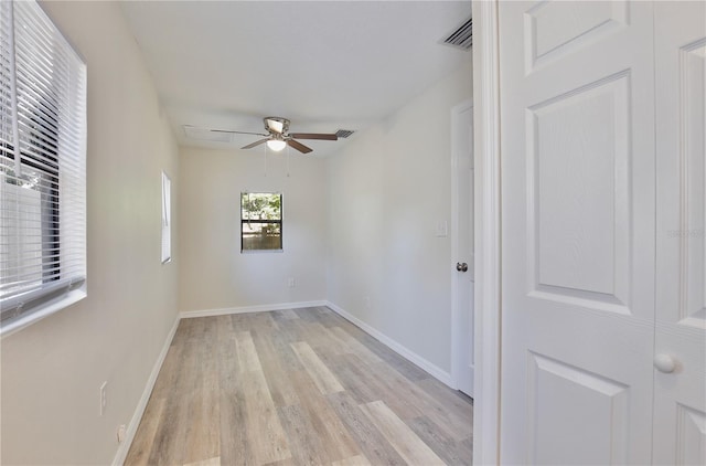 222 E Atwater Ave, Eustis, FL 32726 - empty room with light wood-style floors, ceiling fan, and baseboards