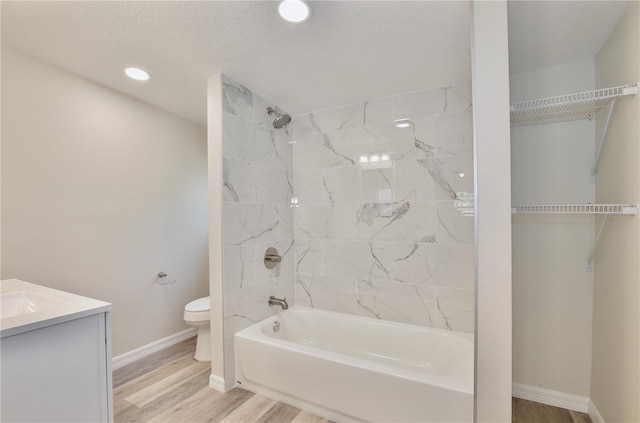 222 E Atwater Ave, Eustis, FL 32726 - full bath featuring toilet, baseboards, wood finished floors, tub / shower combination, and recessed lighting