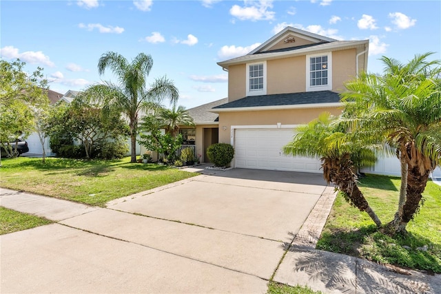 2332 Andrews Valley Dr, Kissimmee, FL 34758 - view of front facade featuring stucco siding, concrete driveway, a front yard, an attached garage, and a shingled roof