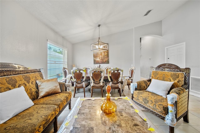 2332 Andrews Valley Dr, Kissimmee, FL 34758 - living area featuring arched walkways, lofted ceiling, and light tile patterned floors