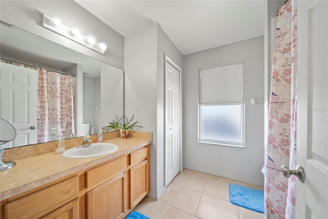 2332 Andrews Valley Dr, Kissimmee, FL 34758 - bathroom with vanity, tile patterned flooring, and baseboards