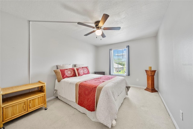 2332 Andrews Valley Dr, Kissimmee, FL 34758 - bedroom with light carpet, baseboards, ceiling fan, and a textured ceiling