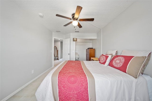 2332 Andrews Valley Dr, Kissimmee, FL 34758 - bedroom featuring light carpet, baseboards, a textured ceiling, ceiling fan, and a closet