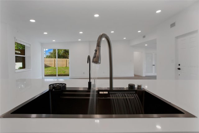 4201 Mizell St, Orlando, FL 32812 - kitchen with a sink, recessed lighting, and light countertops