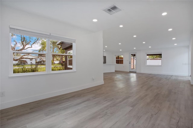 4201 Mizell St, Orlando, FL 32812 - unfurnished living room featuring recessed lighting, light wood-type flooring, and baseboards