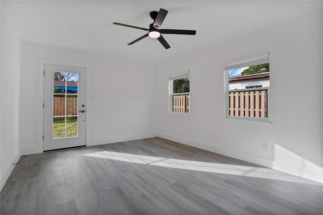 4201 Mizell St, Orlando, FL 32812 - unfurnished room featuring wood finished floors, baseboards, and ceiling fan
