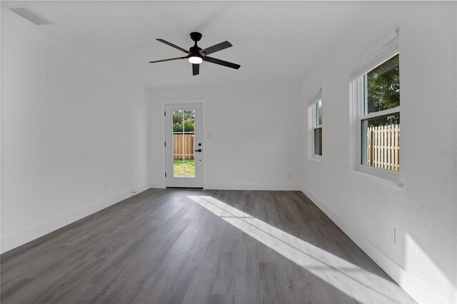 4201 Mizell St, Orlando, FL 32812 - empty room featuring wood finished floors, ceiling fan, and baseboards