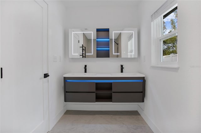 4201 Mizell St, Orlando, FL 32812 - full bath featuring baseboards, double vanity, and marble look tile flooring