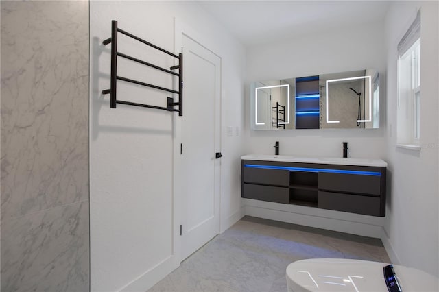4201 Mizell St, Orlando, FL 32812 - full bath with toilet, double vanity, baseboards, and a towel warming rack
