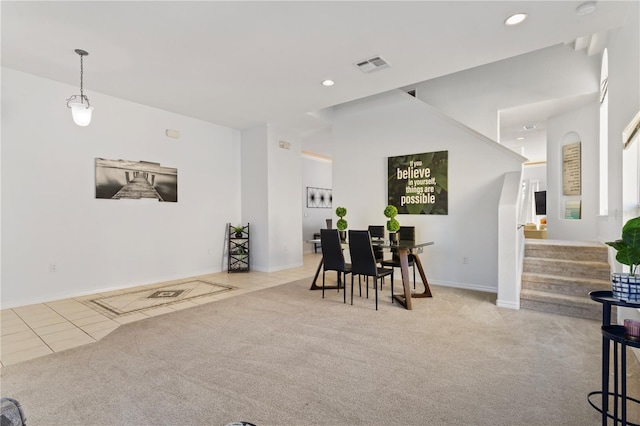 558 Cadiz Loop, Davenport, FL 33837 - tiled dining room featuring carpet floors, stairs, recessed lighting, and baseboards