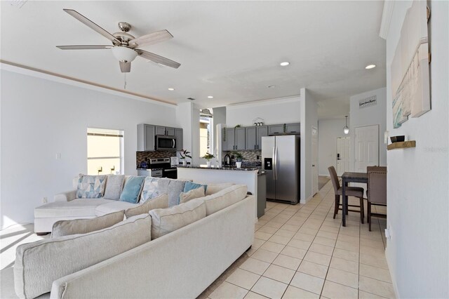 558 Cadiz Loop, Davenport, FL 33837 - living area with light tile patterned floors, a ceiling fan, recessed lighting, and crown molding