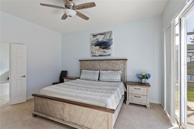 558 Cadiz Loop, Davenport, FL 33837 - bedroom with light colored carpet, baseboards, and a ceiling fan