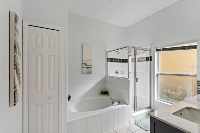 558 Cadiz Loop, Davenport, FL 33837 - full bathroom with a closet, a garden tub, a stall shower, and vanity