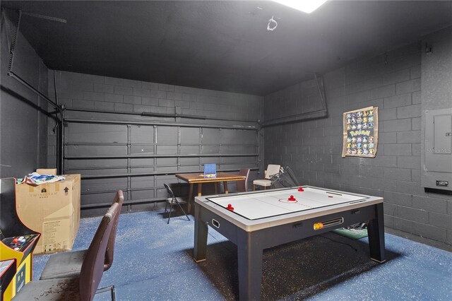558 Cadiz Loop, Davenport, FL 33837 - game room with concrete block wall, a garage, and electric panel