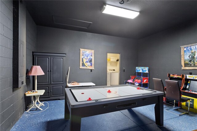 558 Cadiz Loop, Davenport, FL 33837 - game room featuring separate washer and dryer, attic access, concrete block wall, and an office area