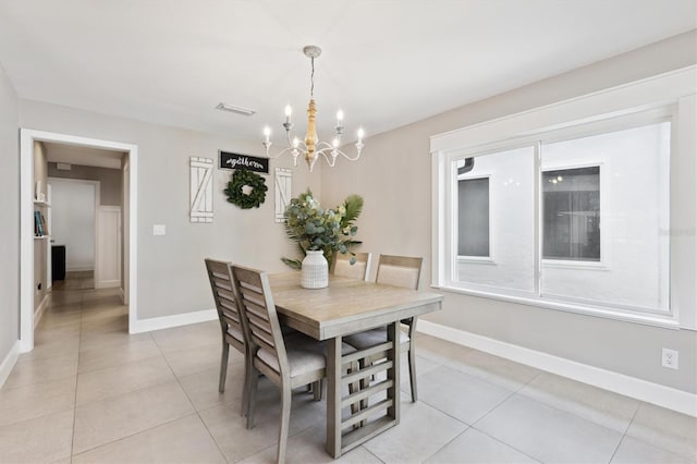 1327 Bridgeport Dr, Winter Park, FL 32789 - dining space featuring a chandelier and light tile patterned floors