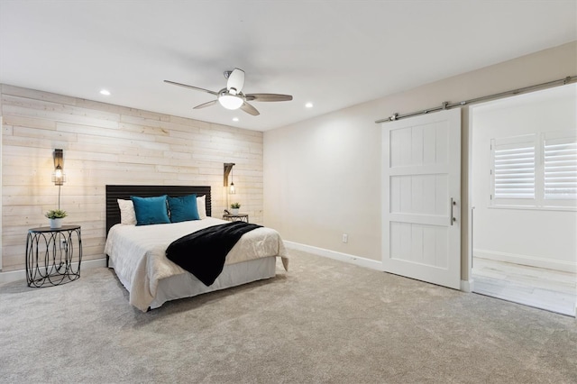 1327 Bridgeport Dr, Winter Park, FL 32789 - carpeted bedroom featuring a barn door, recessed lighting, and ceiling fan