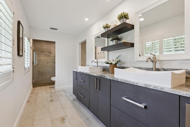 1327 Bridgeport Dr, Winter Park, FL 32789 - full bath with double vanity, a stall shower, and recessed lighting