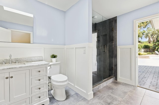 1327 Bridgeport Dr, Winter Park, FL 32789 - full bath featuring a shower stall, vanity, a decorative wall, and a wainscoted wall
