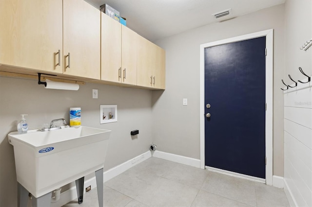 1327 Bridgeport Dr, Winter Park, FL 32789 - laundry room featuring cabinet space, washer hookup, and light tile patterned floors