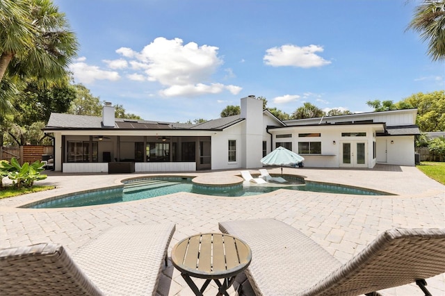 1327 Bridgeport Dr, Winter Park, FL 32789 - outdoor pool featuring french doors, a sunroom, a hot tub, ceiling fan, and a patio