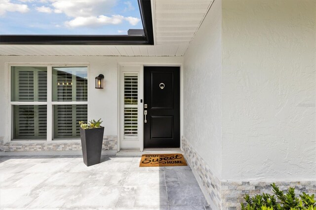 1327 Bridgeport Dr, Winter Park, FL 32789 - doorway to property with stucco siding