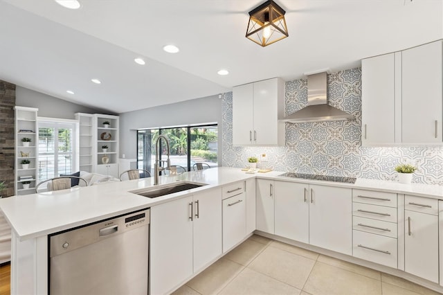 1327 Bridgeport Dr, Winter Park, FL 32789 - kitchen with wall chimney range hood, stainless steel dishwasher, black electric stovetop, a peninsula, and lofted ceiling