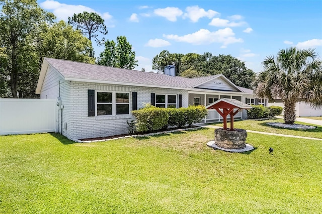 174 Pine Grove Ct, Daytona Beach, FL 32119 - view of front of property with brick siding, a chimney, and roof with shingles