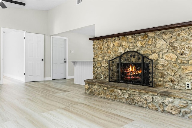 174 Pine Grove Ct, Daytona Beach, FL 32119 - unfurnished living room with a fireplace, ceiling fan, a high ceiling, wood finished floors, and baseboards