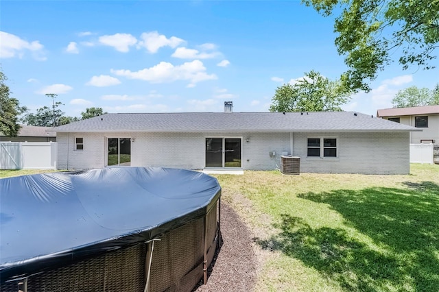 174 Pine Grove Ct, Daytona Beach, FL 32119 - back of property with brick siding and central AC unit