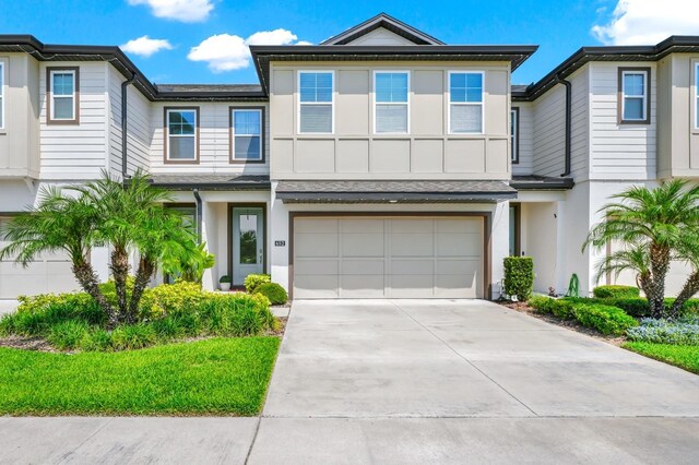 652 Benoi Dr, Davenport, FL 33896 - multi unit property with a garage, concrete driveway, and stucco siding