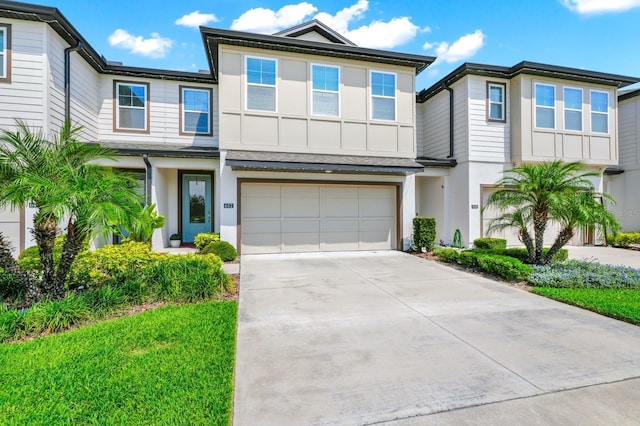 652 Benoi Dr, Davenport, FL 33896 - view of front of property featuring driveway, an attached garage, and stucco siding