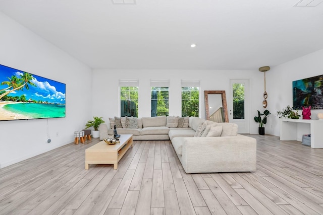652 Benoi Dr, Davenport, FL 33896 - living room featuring light wood-style flooring, healthy amount of natural light, and recessed lighting
