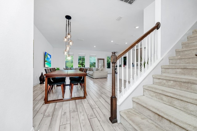 652 Benoi Dr, Davenport, FL 33896 - dining room featuring stairs, light wood finished floors, and recessed lighting