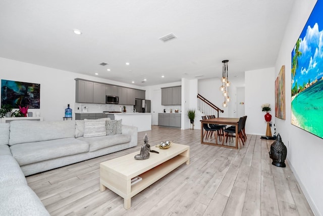 652 Benoi Dr, Davenport, FL 33896 - living area featuring light wood-style flooring, recessed lighting, and baseboards