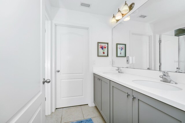 652 Benoi Dr, Davenport, FL 33896 - full bathroom featuring double vanity and tile patterned floors