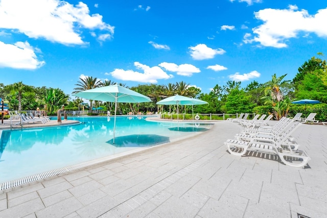 652 Benoi Dr, Davenport, FL 33896 - community pool featuring a patio