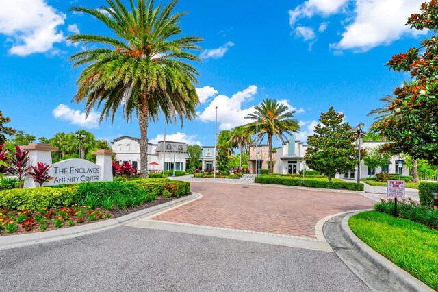 652 Benoi Dr, Davenport, FL 33896 - view of asphalt street featuring street lights, curbs, and a residential view