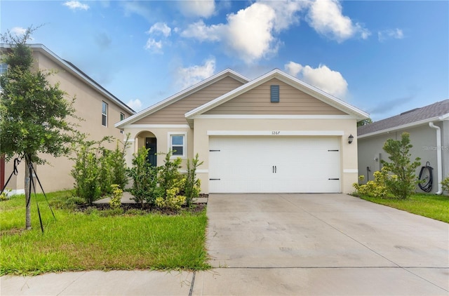 1267 Berry Ln, Davenport, FL 33837 - ranch-style home featuring driveway, an attached garage, and stucco siding