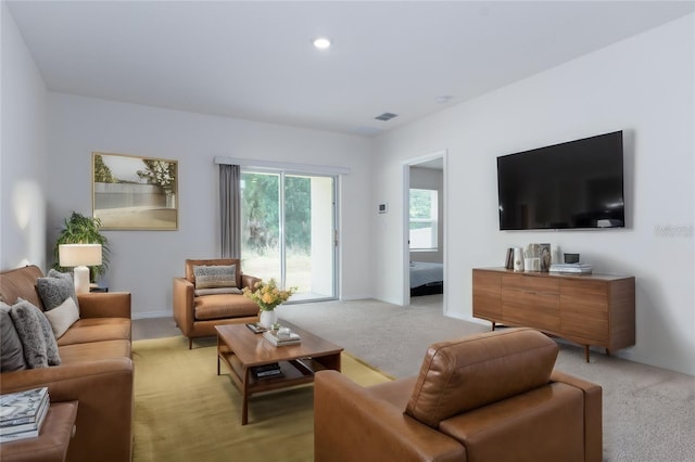 1267 Berry Ln, Davenport, FL 33837 - living area with light colored carpet, recessed lighting, and baseboards