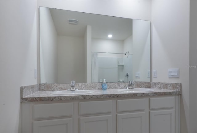 1267 Berry Ln, Davenport, FL 33837 - full bathroom featuring double vanity and a shower
