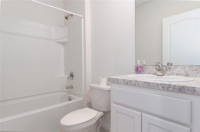 1267 Berry Ln, Davenport, FL 33837 - bathroom with toilet, vanity, and washtub / shower combination
