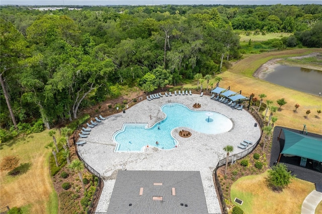 1267 Berry Ln, Davenport, FL 33837 - aerial view of a pool, a forest, and a nearby body of water