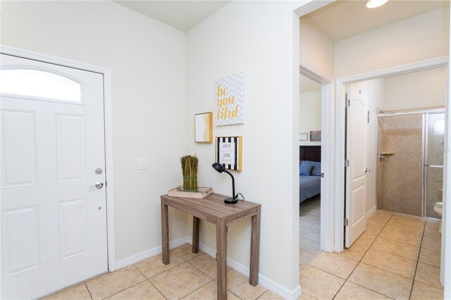 1979 Majorca Dr, Kissimmee, FL 34747 - foyer entrance featuring light tile patterned flooring and baseboards