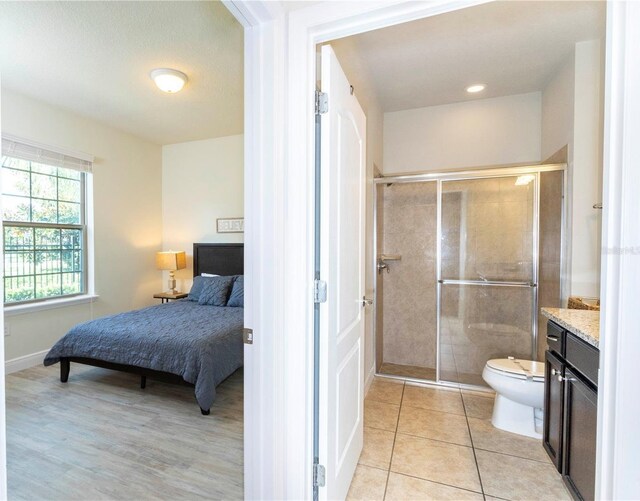 1979 Majorca Dr, Kissimmee, FL 34747 - bedroom with baseboards and light tile patterned floors