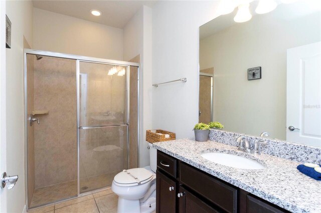 1979 Majorca Dr, Kissimmee, FL 34747 - full bath with a stall shower, toilet, tile patterned flooring, and vanity