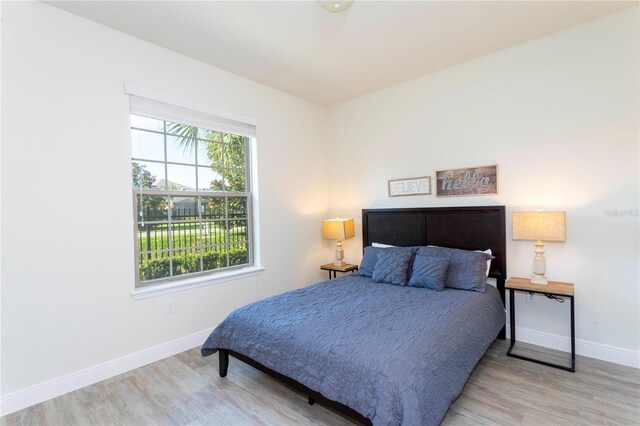 1979 Majorca Dr, Kissimmee, FL 34747 - bedroom featuring baseboards and wood finished floors