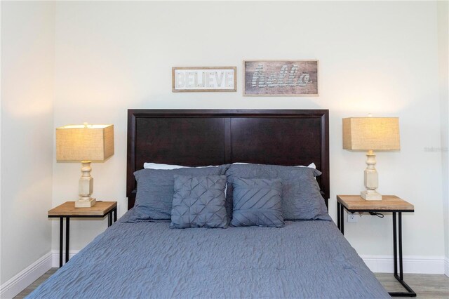 1979 Majorca Dr, Kissimmee, FL 34747 - bedroom with baseboards and wood finished floors