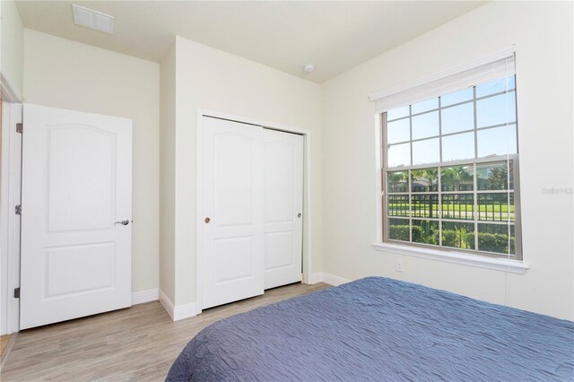 1979 Majorca Dr, Kissimmee, FL 34747 - bedroom with multiple windows, wood finished floors, and baseboards